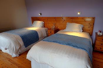 Comfortable ensuite bedrooms with 2 small double beds each